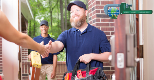 Plumber shaking hand of woman